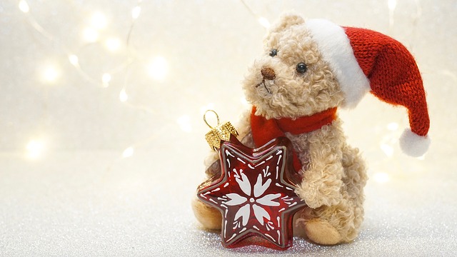 teddy in Santa hat with Christmas bauble