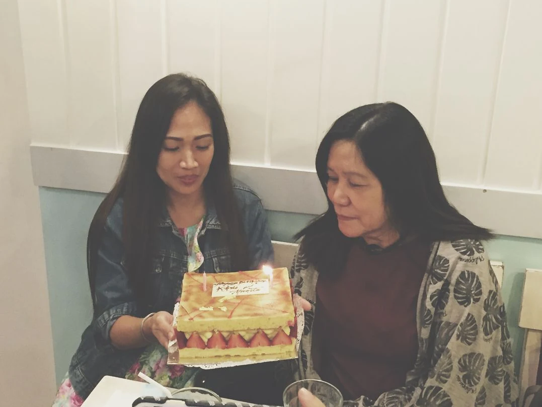 My monther-in-law blowing the candle on the birthday cake during our Stacy’s BGC baby shower