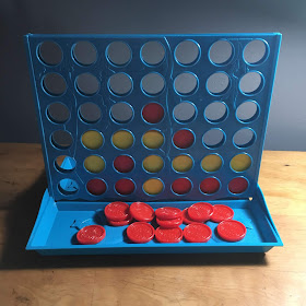 Photo of the knock-off Connect 4 game that broke when I tried t put it together