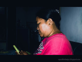 A Wife Still Doing Homework At Night At Seririt Village, North Bali, Indonesia