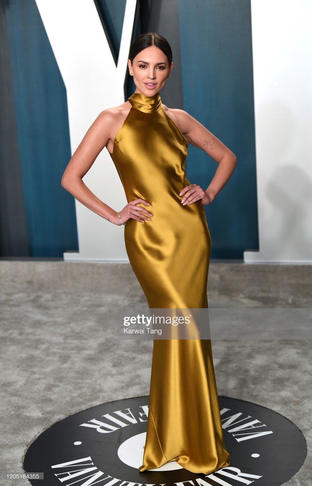 Ladies in Satin Blouses: Eiza Gonzales - gold satin dress