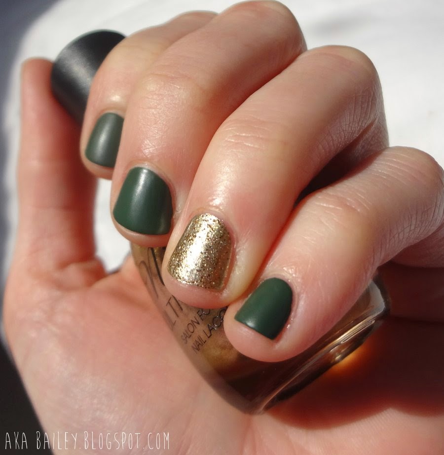 Matte green nails with sparkling gold accent nails