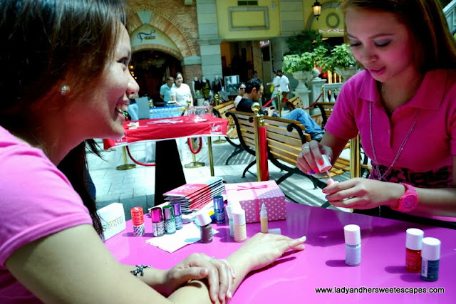 my friend during her free manicure session Models Own booth