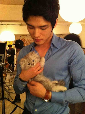  actor holding kitten 