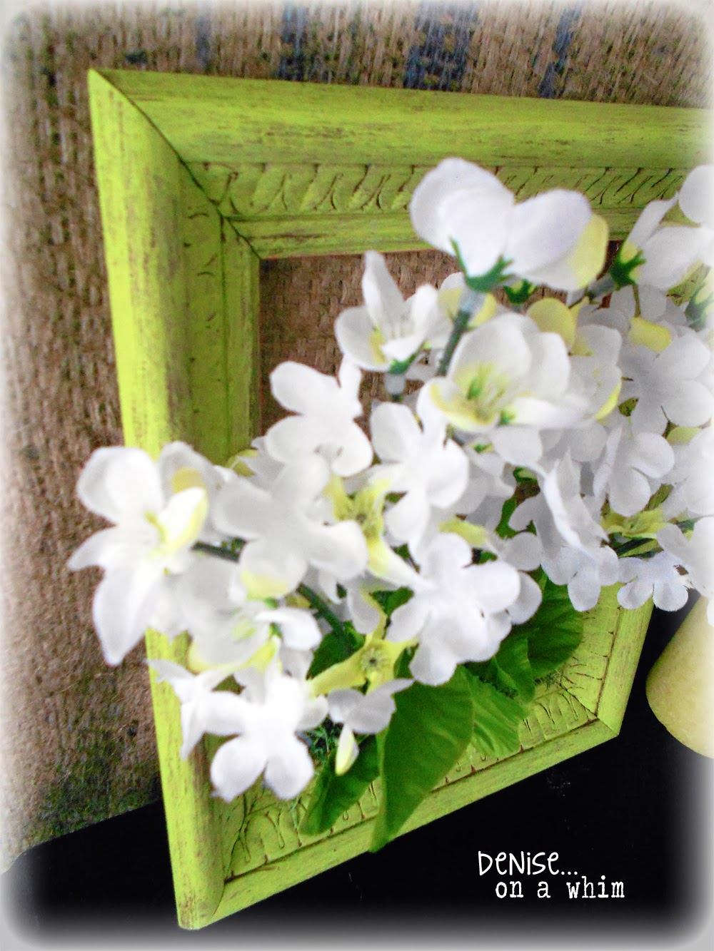 Dollar store flowers look so pretty in this spring frame via http://deniseonawhim.blogspot.com