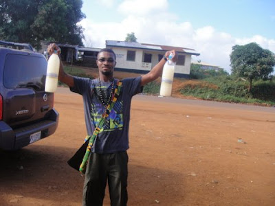 Liberian man with palm wine alcohol