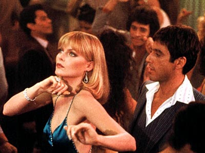 Al Pacino as Tony Montana, Michelle Pfeiffer as the mobster's moll Elvira Hancock, Scarface, Directed by  Brian De Palma