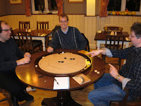 Crokinole - The players enjoying the game