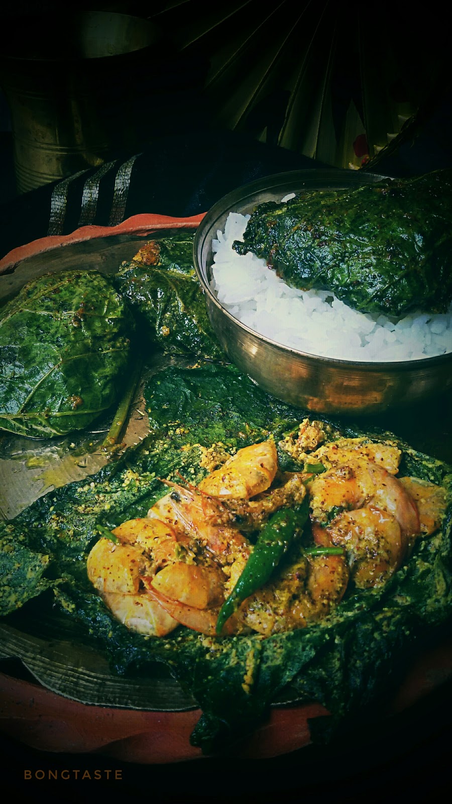 Bongtaste Lau Patae Chingri Paturi (Prawns Cooked in Bottle gourd leaf)