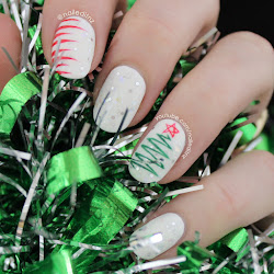 nail christmas tree candy canes lights snowflakes nailed