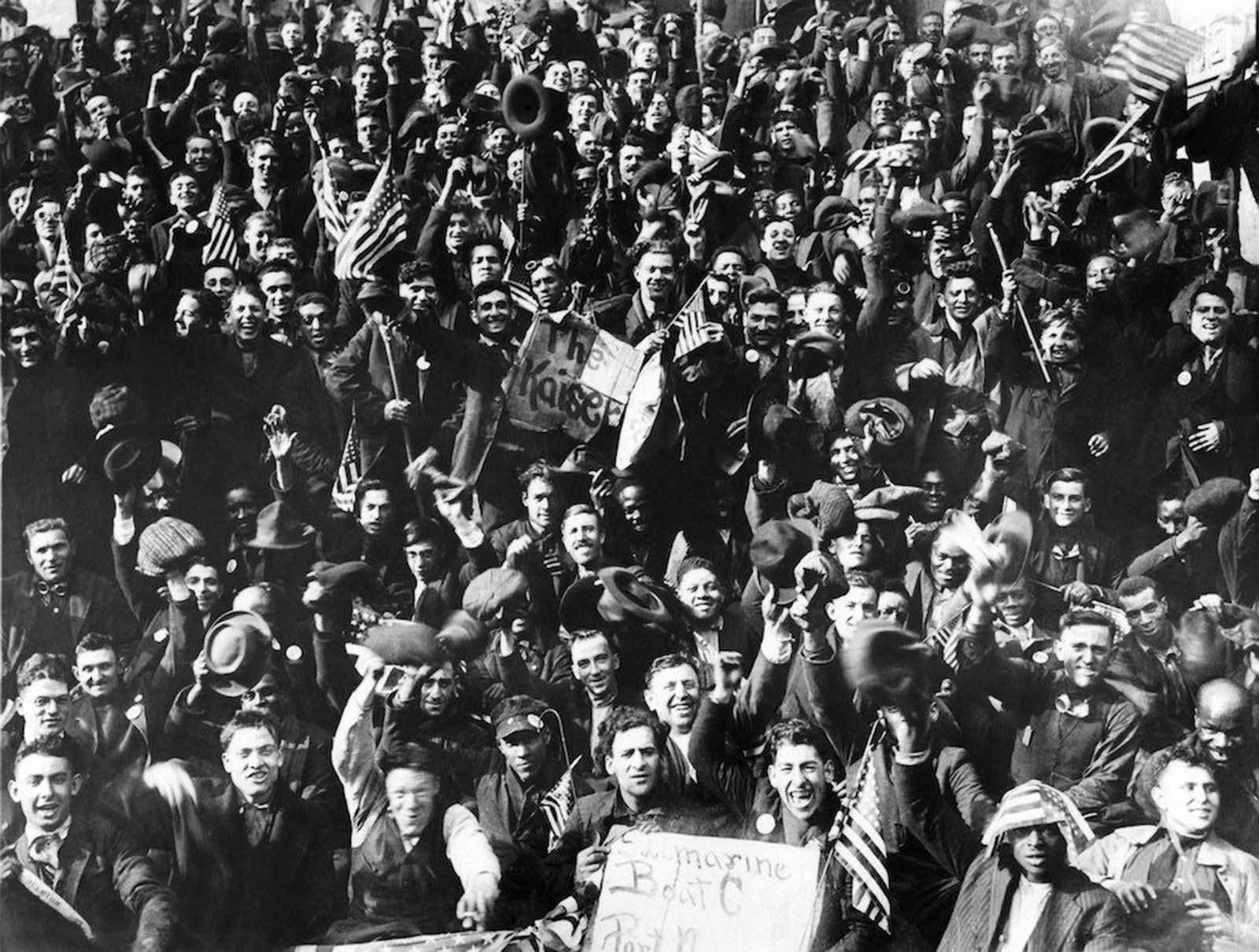 Cheering New York shipyard workers celebrate the news of the Armistice, New York.