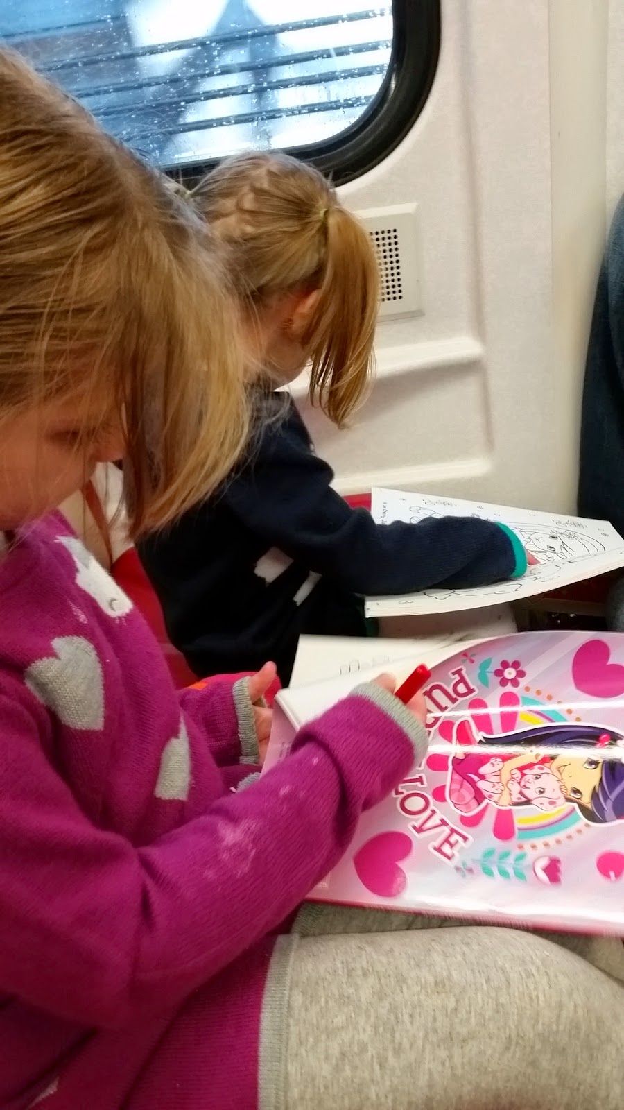 4 year old and 2 year old on train coloring