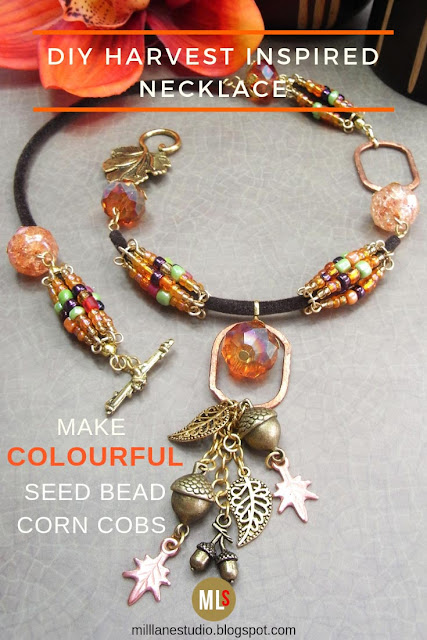 Seed bead corn cob necklace with acorn and leaf charm dangles.
