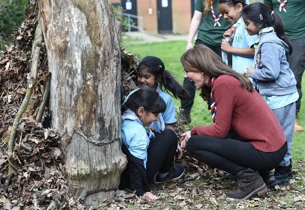 Kate Middleton is wearing her J Crew Mockneck sweater and Chloe boots