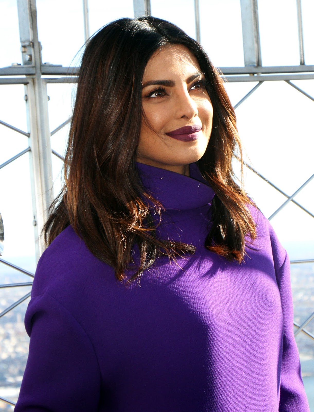 Priyanka Chopra Looks Sexy In a Purple Short Dress and Black Thigh High Boots During â€œQuanticoâ€ Promotion at The Empire State Building in New York City