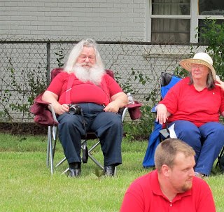 real santa clause sitting in chair at parade, redford