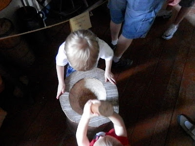A Mom's Quest to Teach: Trips: Washington Crossing State Park Trip - There are so many great things to see at Washington State Park! #roadtrips #history #naturecenter #homeschool Grinding corn