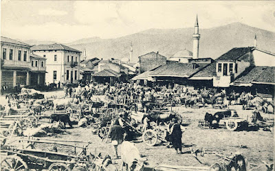 Wood Market on photo postcard from 1916 with a view to the southwest. This is one of the most common items of German postcards and photographs. Photographed from all angles usually on market day when its full with sellers from surrounding villages with their carts. In the background is seen Baba Mountain and some of the mosques.