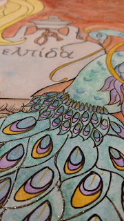 close up picture of the peacock feathers in the art piece