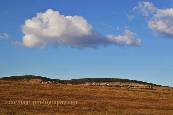 Autumn silence-rusty fields against the blue sky