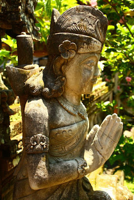 Statue of Balinese woman praying to god