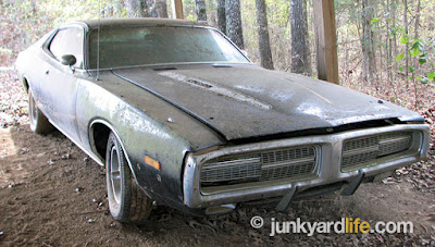 Black and white 340 equipped 1973 Dodge Charger has been customized with 1972 model hideaway headlights.