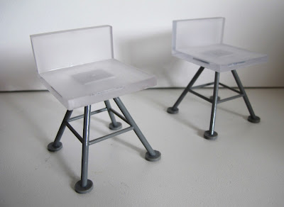 Two modern dolls' house miniature white and grey bar stools from the Kaleidoscope House.