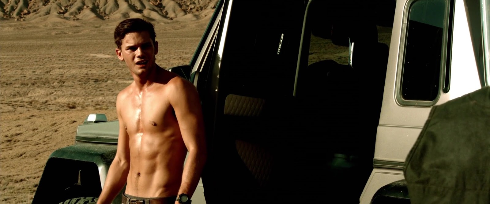 Jeremy Irvine shirtless in Beyond The Reach.