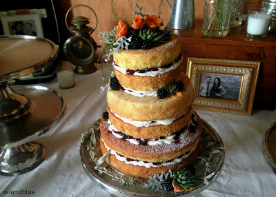   Naked Wedding Cake with Succulents, Dusty Miller, and Roses (white chocolate with blackberry jam) from oilandblue
