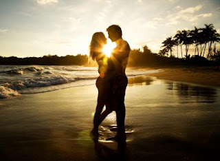 Man & Woman Embracing On The Beach