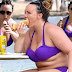 Former Big Brother star Chanelle Hayes tucks into giant hotdog on holiday