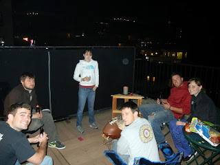 Friends gathered for a cook-out on a rooftop patio
