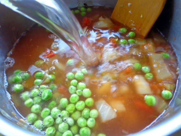 Add chopped tomatoes, peas, water, salt and bay leaf