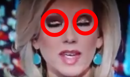 Reporter Caught Shape-Shifting Eyes Live On Air.