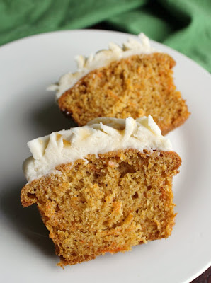 carrot cake cupcake cut in half with moist inside texture showing