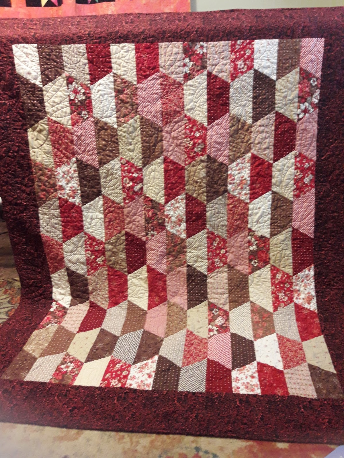 Muddling Through Red and Brown Half Hexagon Quilt