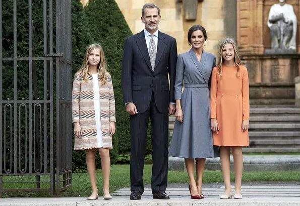 Queen Letizia wore grey coat dress, Crown Princess Leonor wore a Mango pattern jacket and Infanta Sofía wore a coral Mango dress