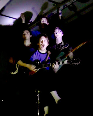 Official Video for Flaccid Ashbacks' "An Egg" featuring a dark basement, fantastical guitar kick and naked drumming