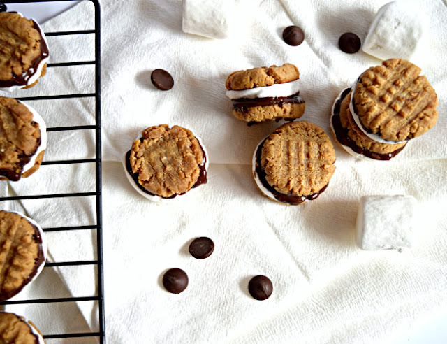 S'more Peanut Butter Cookie Sandwiches are bite size and a delicious twist from a traditional campfire s'more. These little cookies are gluten free and filled with good, clean ingredients.