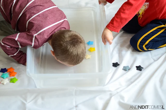 Bobbing for stars sensory bin - a fun oral motor sensory activity for kids from And Next Comes L