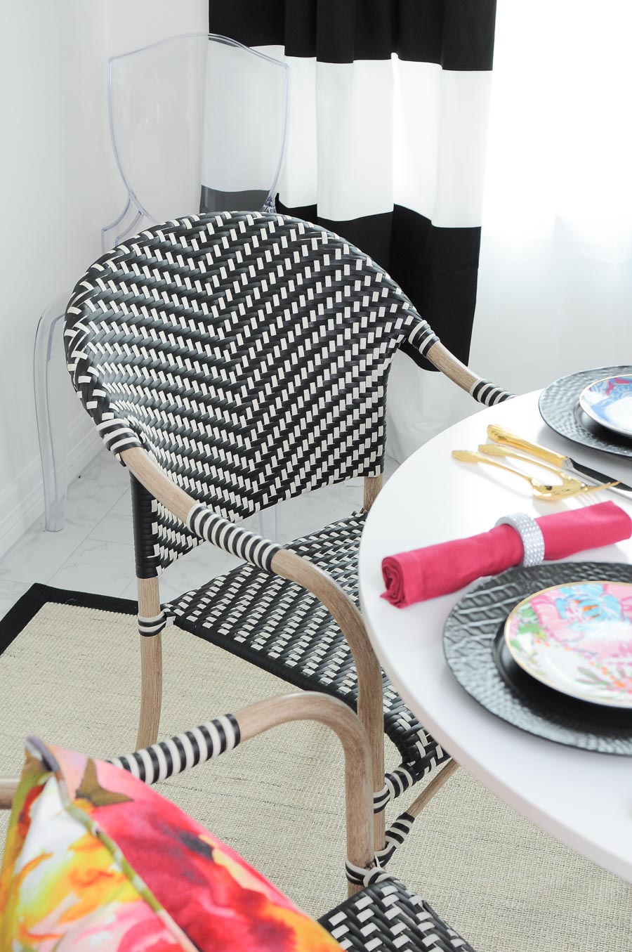These $44 Parisian Dining Room Chairs look amazing in this small dining space decorated in bold black and white.