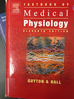 Textbook of Medical Physiology, by Guyton and Hall, superimposed on Intermediate Physics for Medicine and Biology.