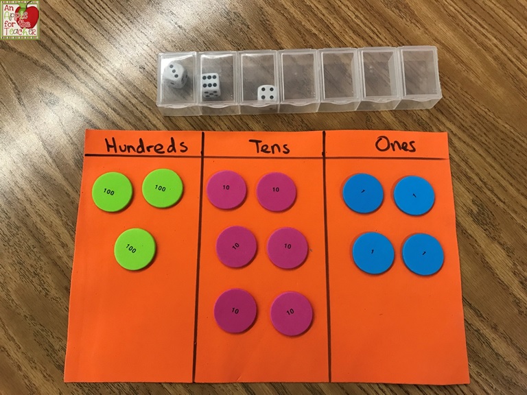 An Apple For The Teacher Using a Pill Box and Dice to Practice Place Value