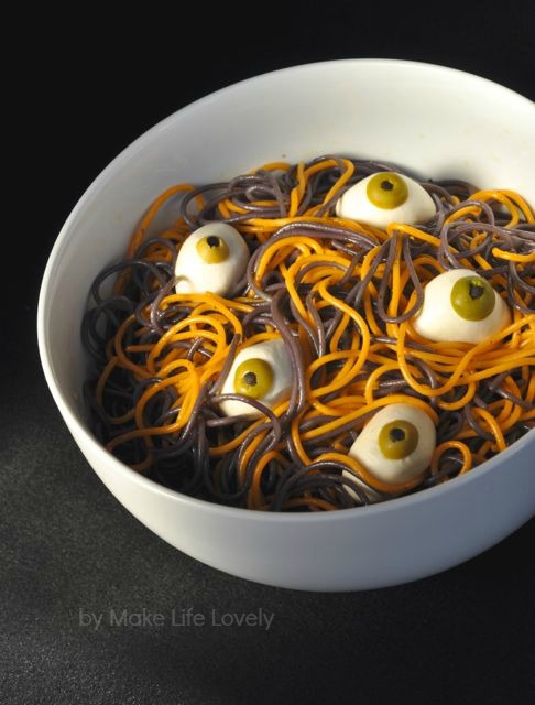 Spooky spaghetti with eyeballs Halloween dinner recipe. Looks gross but tastes great!