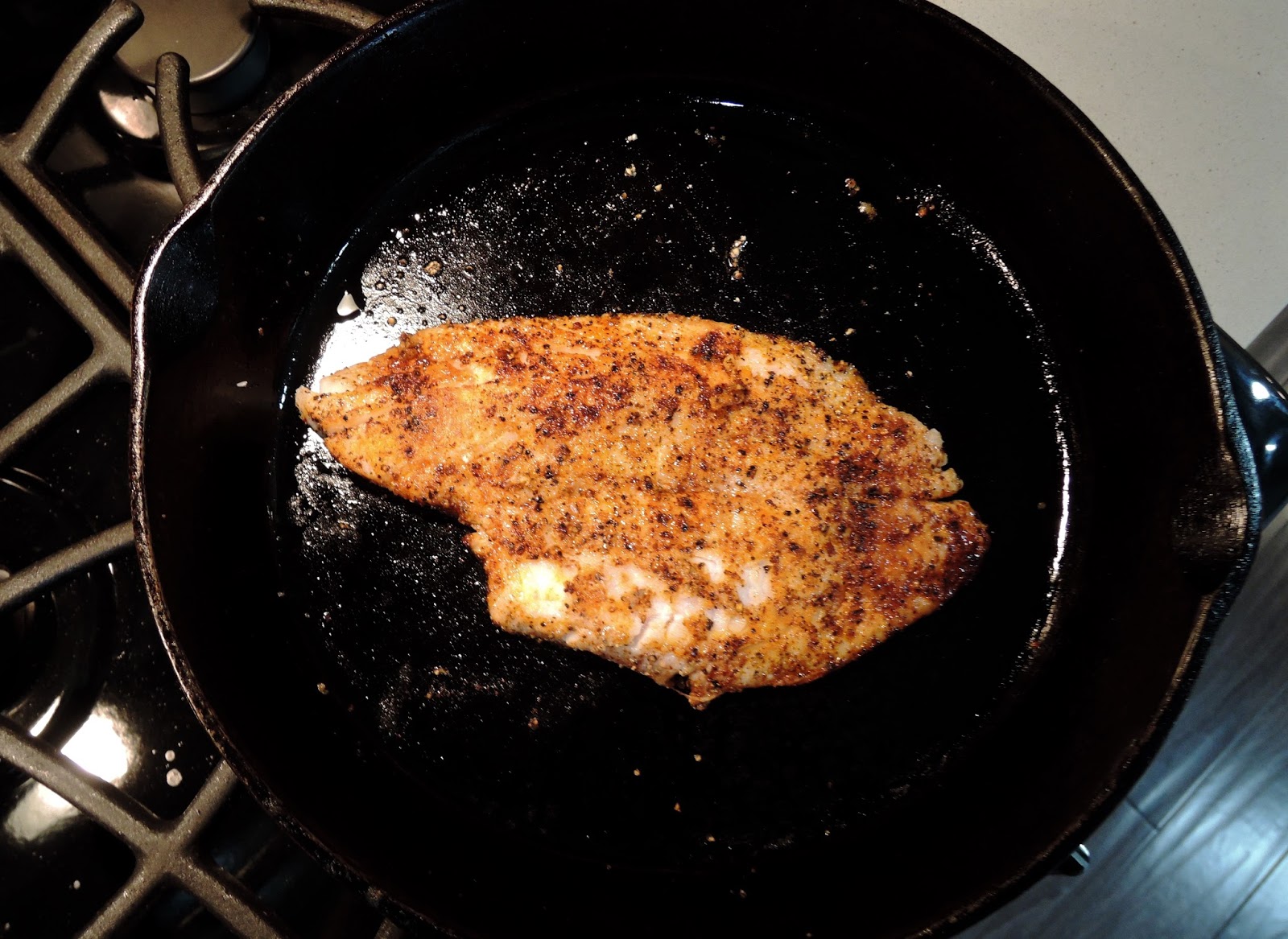 The Briny Lemon Blackened Flounder with Garlic Sautéed Kale