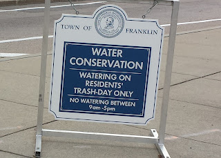the water restriction sign normally positioned at the triangle downtown
