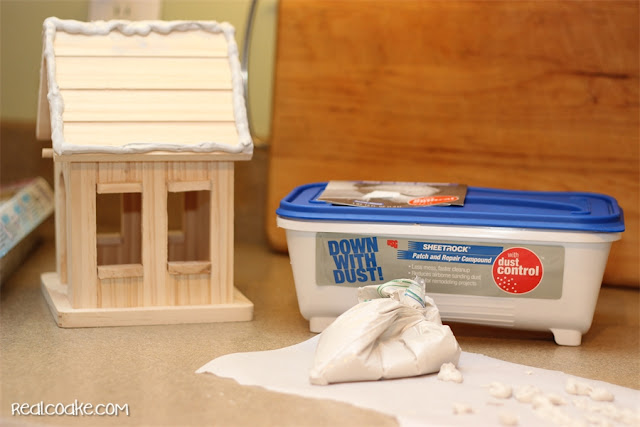 A DIY Christmas Craft to make a cute wood Gingerbread House from realcoake.com
