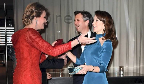 Queen Mathilde, Crown Princess mary, Princess Marie, Princess Elisabeth, Prince Joachim and Prince Frederik attend a dinner at the Black Diamond.Queen wore Armani red gown, Princess wore blue dress and red dress