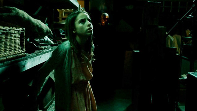 a ghost haunts a little girl in a basement