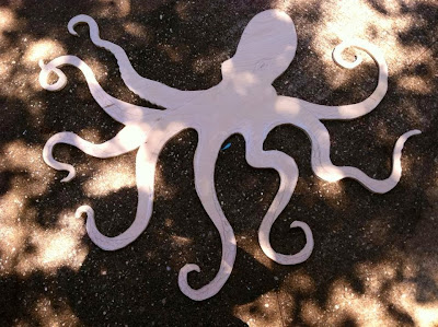 large wood cut out of octopus